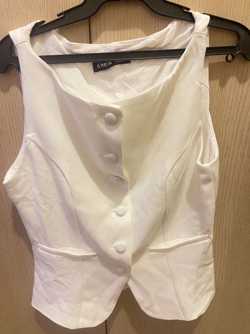 Shein White Vest and Pants Set (Category: Sets or Coordinates) located in Paranaque City. Submitted by timzells (Listing ID 1422073063, Image 1). Description: - Shein white vest and pants set. - Vest: Button-up front, tailored design. - Pants: Elastic waistband. - Fabric: Smooth, likely synthetic. - Perfect for a coordinated look. - Versatile for various occasions..