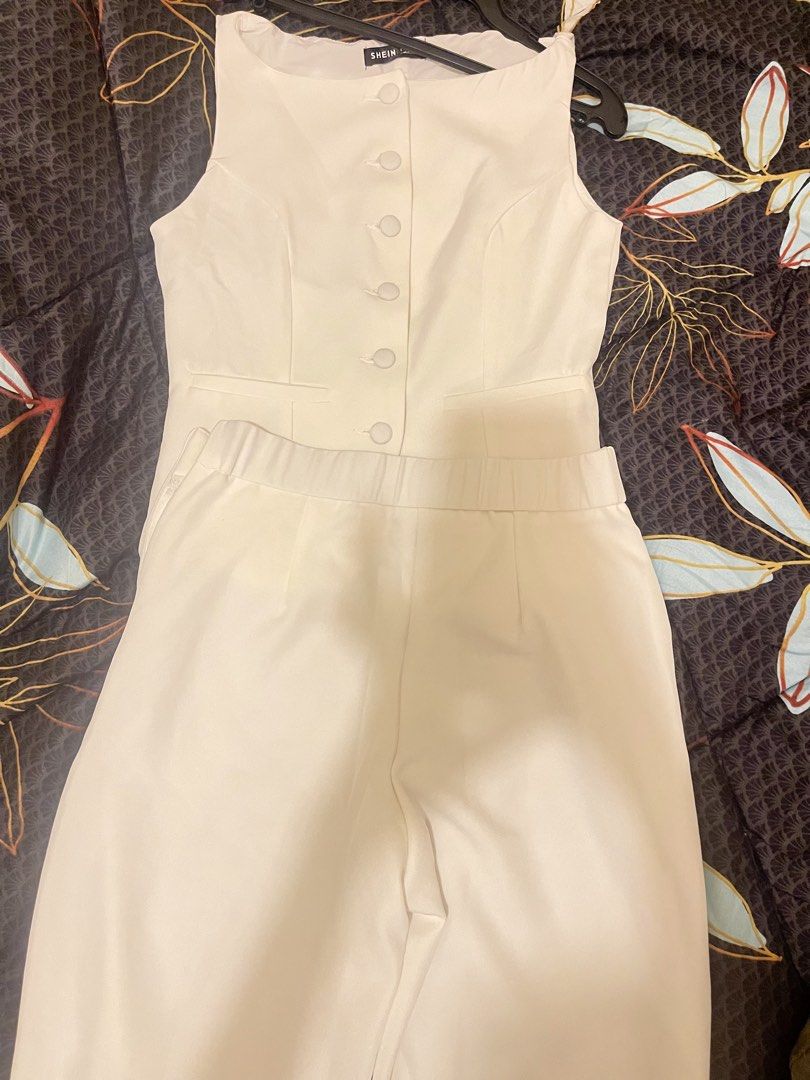 Shein White Vest and Pants Set (Category: Sets or Coordinates) located in Paranaque City. Submitted by timzells (Listing ID 1422073063, Image 2). Description: - Shein white vest and pants set. - Vest: Button-up front, tailored design. - Pants: Elastic waistband. - Fabric: Smooth, likely synthetic. - Perfect for a coordinated look. - Versatile for various occasions..