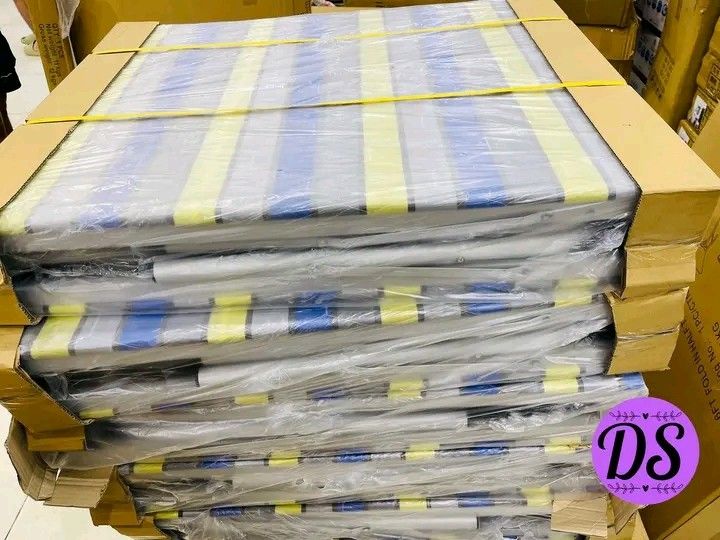 Single Bed Frame with Mattress (Category: Bed Frames & Mattresses) located in Manila. Submitted by micoooy (Listing ID 1421944442, Image 2). Description: - New single bed frame - Foldable white metal frame - Includes striped mattress (blue, yellow, gray) - Item is brand new - Still in original packaging.