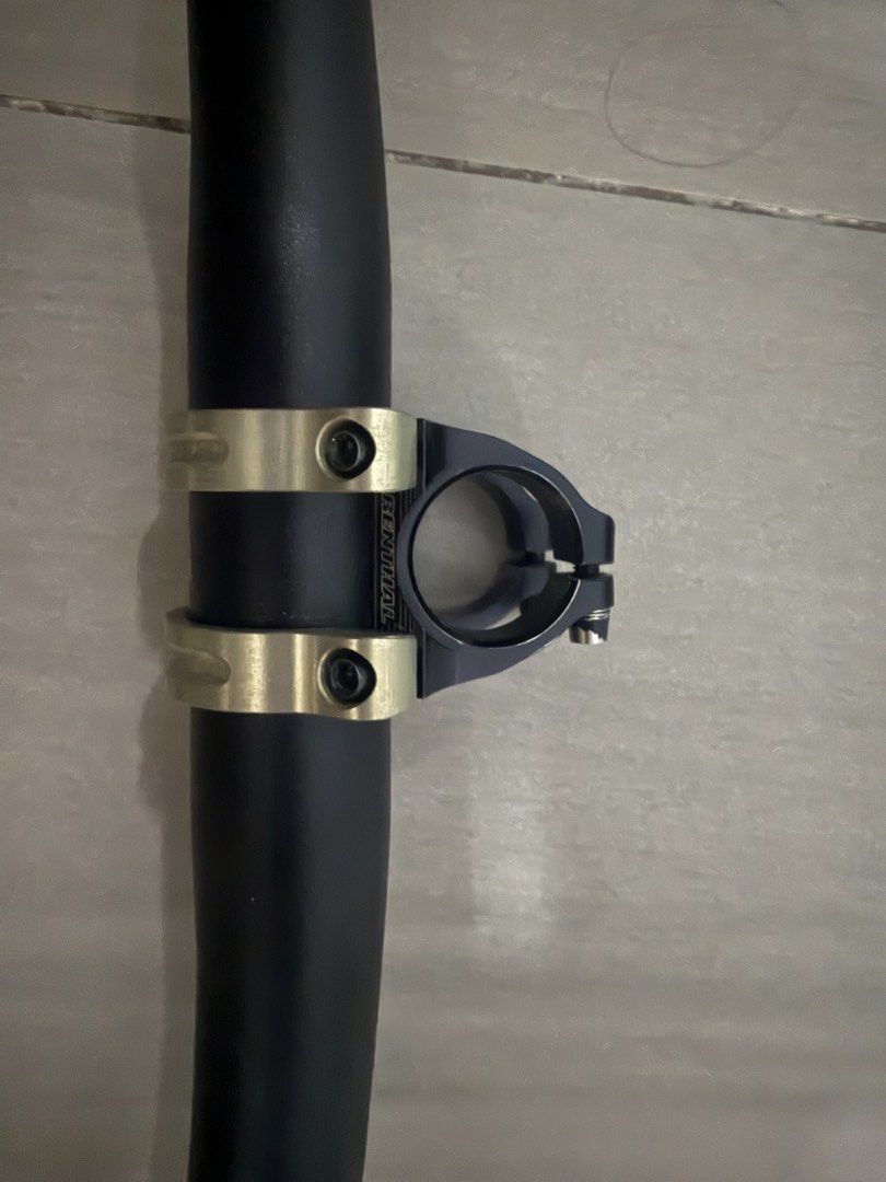 Spank Spoon 35 Handlebar with Renthal Stem (Category: Bicycles) located in Quezon City. Submitted by ronsatch (Listing ID 1421941346, Image 3). Description: - Spank Spoon 35 handlebar 740 - Renthal stem 35/35 - Yellow Troy Lee Designs grips - Black handlebar and stem - Gold-colored stem clamp - Textured grips - Spank logo present.