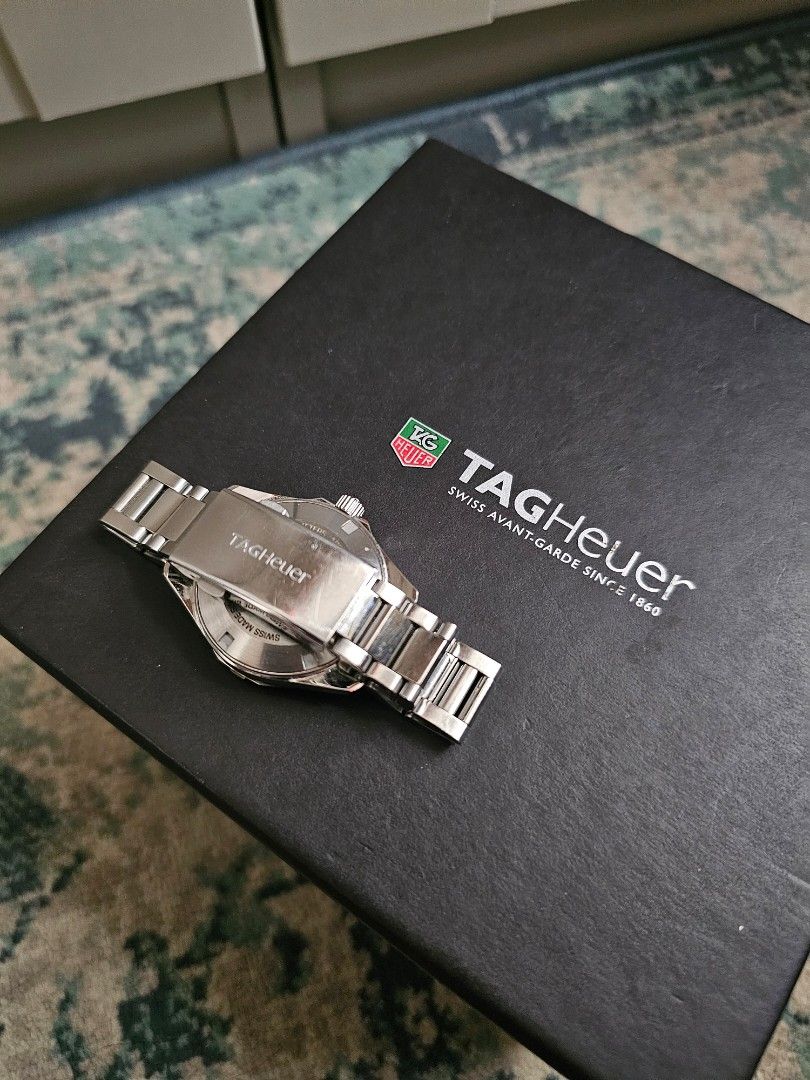 Tag Heuer Aquaracer Quartz Watch (Category: Luxury Watches) located in Manila. Submitted by mymyg (Listing ID 1421945174, Image 2). Description: - Authentic Tag Heuer Aquaracer - Black dial - Stainless steel bracelet - Quartz movement - Date display - Includes original box, warranty card, and instruction manual - Sapphire crystal - Water-resistant to 300 meters - Folding clasp with safety release - serviced in 2022 - fresh batteries - original ex