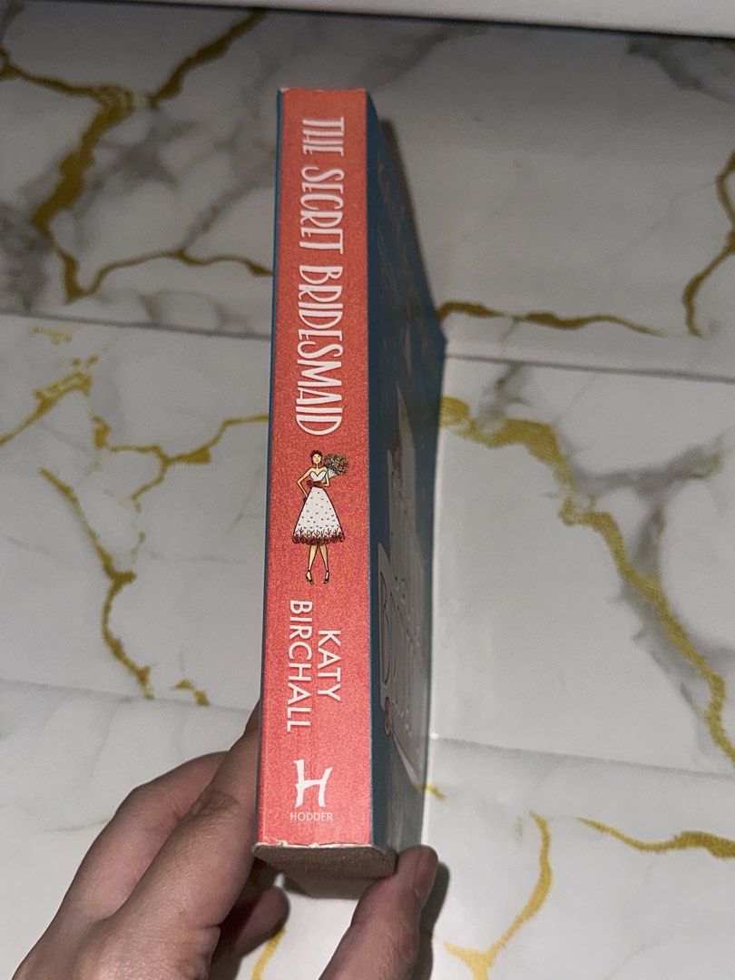 The Secret Bridesmaid by Katy Birchall (Category: Storybooks) located in Manila. Submitted by shaaan73 (Listing ID 1421980107, Image 2). Description: Secret Bridesmaid by Katy Birchall. Paperback with a teal cover and cake design. Pages show slight yellowing..