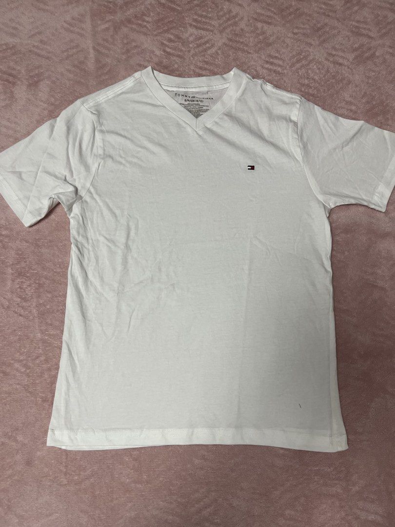 Tommy Hilfiger V-Neck T-Shirt (Category: Babies & Kids Fashion) located in Paranaque City. Submitted by princessann0721 (Listing ID 1422056444, Image 1). Description: - Tommy Hilfiger V-neck t-shirt - Features the iconic Tommy Hilfiger logo - Classic fit - Short sleeves - Lightweight fabric - Perfect for everyday wear - Brand New but No Tag.
