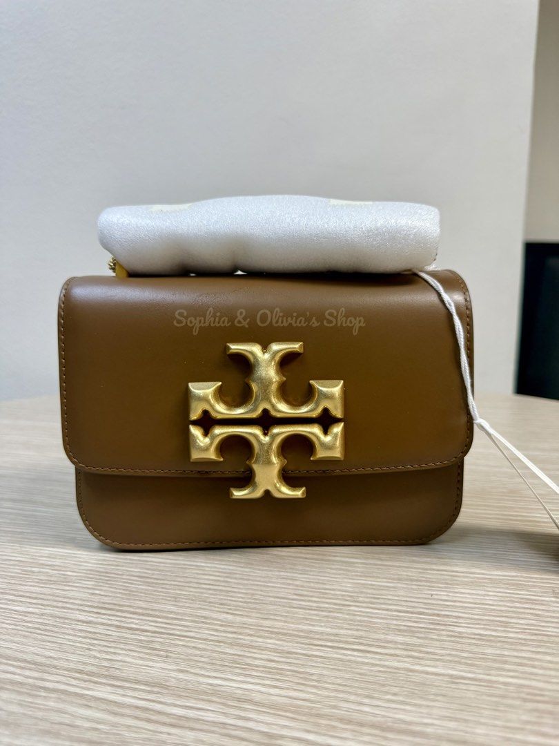 Tory Burch Eleanor Small Convertible Shoulder Bag (Category: Luxury Bags & Wallets) located in Pasig City. Submitted by ellaandviashop (Listing ID 1421949056, Image 1). Description: - Tory Burch Eleanor Small Convertible Shoulder Bag - Brown color - Gold-tone logo detail - Convertible shoulder strap - Flap closure - Green interior 🇵🇭 On hand PH 🆕 Brand New and Ready to Ship 📍Lalamove/LBC Ready 💳 Credit cards accepted .