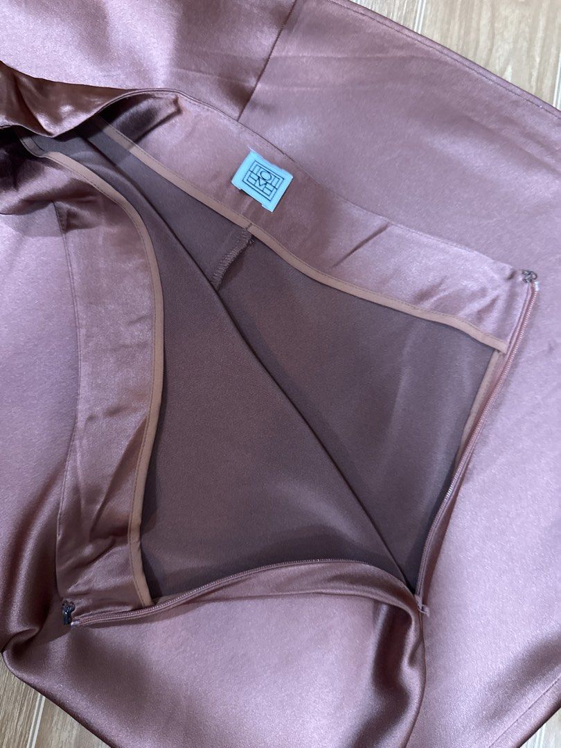 Toteme Silk Midi Skirt (Category: Skirts) located in Quezon City. Submitted by dropdeadprices (Listing ID 1422021269, Image 3). Description: -Toteme - Style: Midi Skirt - Color: Brown - Size: XS - Material: Silky texture - Features: Zipper closure - Perfect for: Sophisticated and stylish looks.