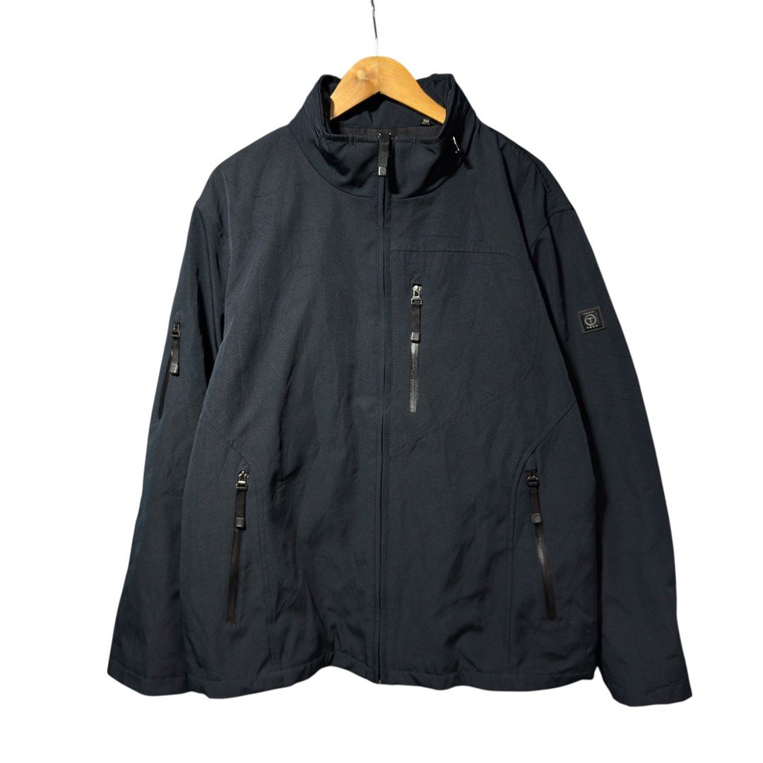 TUMI Tech - Softshell Jacket Packable Hood (Category: Coats, Jackets and Outerwear) located in Cavite. Submitted by gooditems.cavite (Listing ID 1421950809, Image 1). Description: - Tumi Tech Jacket - Size: XXL 27x29 can fit xl - Color: Dark Navy - Features: Full zip closure, multiple zippered pockets, high collar, hidden hood - Lining: Quilted for warmth - Made in Vietnam.