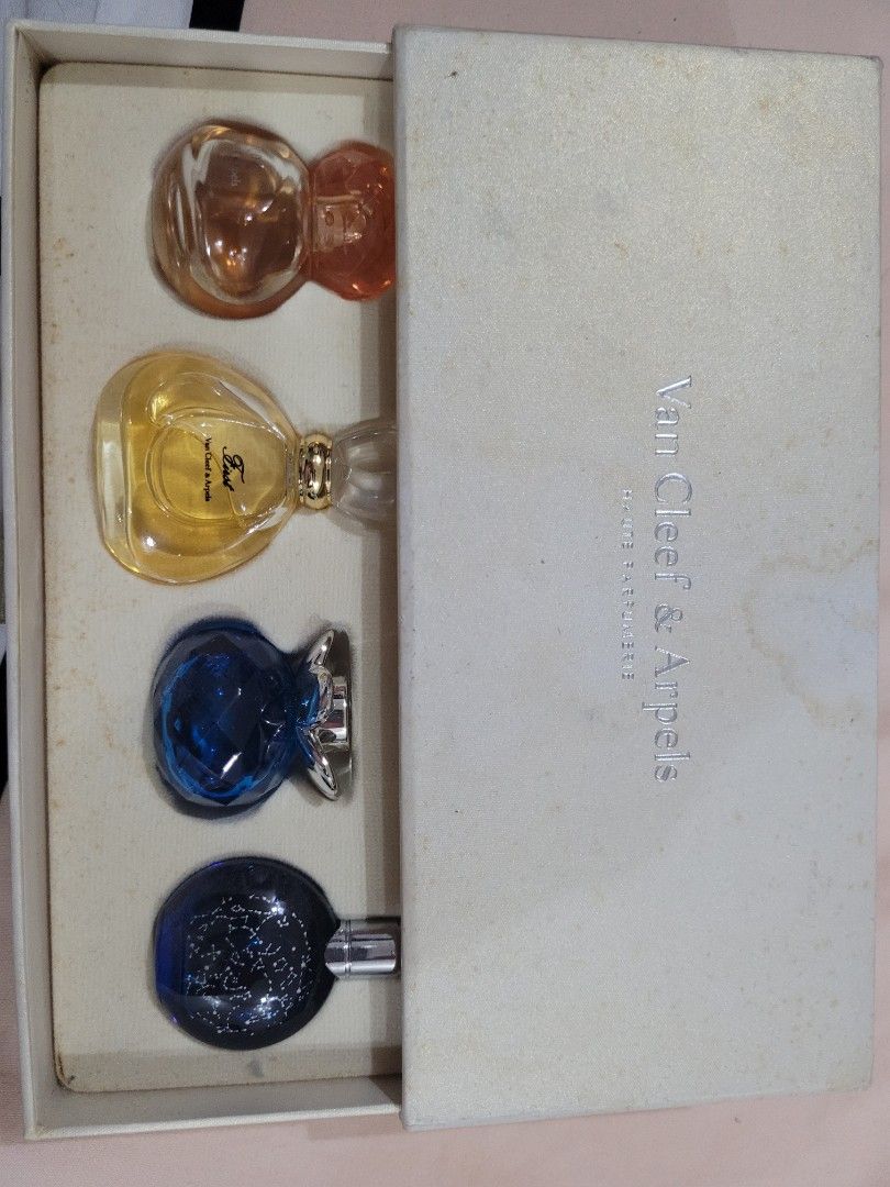 Van Cleef & Arpels Miniature Perfume Set (Category: Fragrance & Deodorants) located in Manila. Submitted by flzoneeee (Listing ID 1421987821, Image 2). Description: - Van Cleef & Arpels Miniature Perfume Set - Includes four miniature perfumes - Variety of fragrances - Bottles in amber, yellow, blue, and dark blue with glitter - Presented in a cream-colored box - Perfect for gifting or trying different scents.