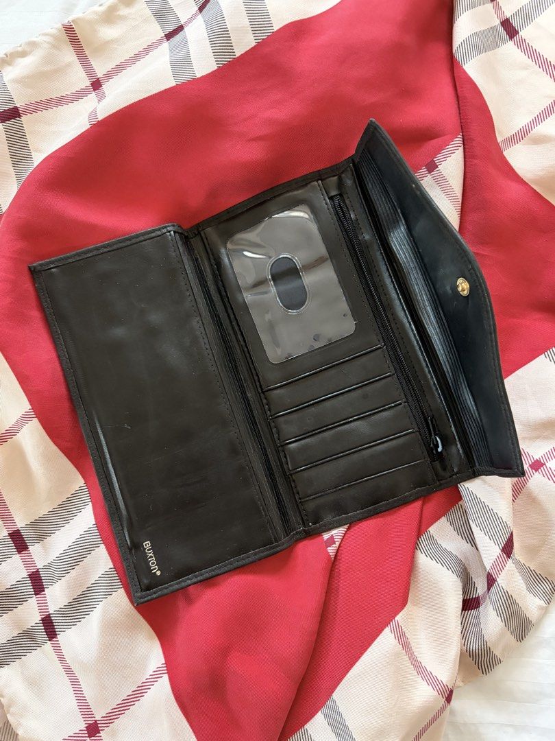Vintage Buxton Black Leather Wallet (Category: Wallets & Card holders) located in Quezon City. Submitted by mackybow (Listing ID 1422000541, Image 3). Description: - Vintage Buxton long black leather wallet - Snap enclosure - 5 card slots - 2 inner compartments - 1 zipped inner compartment - Exterior kisslock compartment - Cowhide leather.