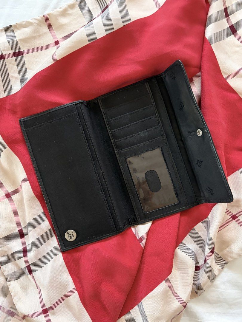 Vintage the Sak Black Wallet (Category: Wallets & Card holders) located in Quezon City. Submitted by mackybow (Listing ID 1421999979, Image 3). Description: - The Sak long black wallet - Tri-fold - Snap enclosure - 5 card slots - 3 inner compartments - Leather exterior, fabric interior.