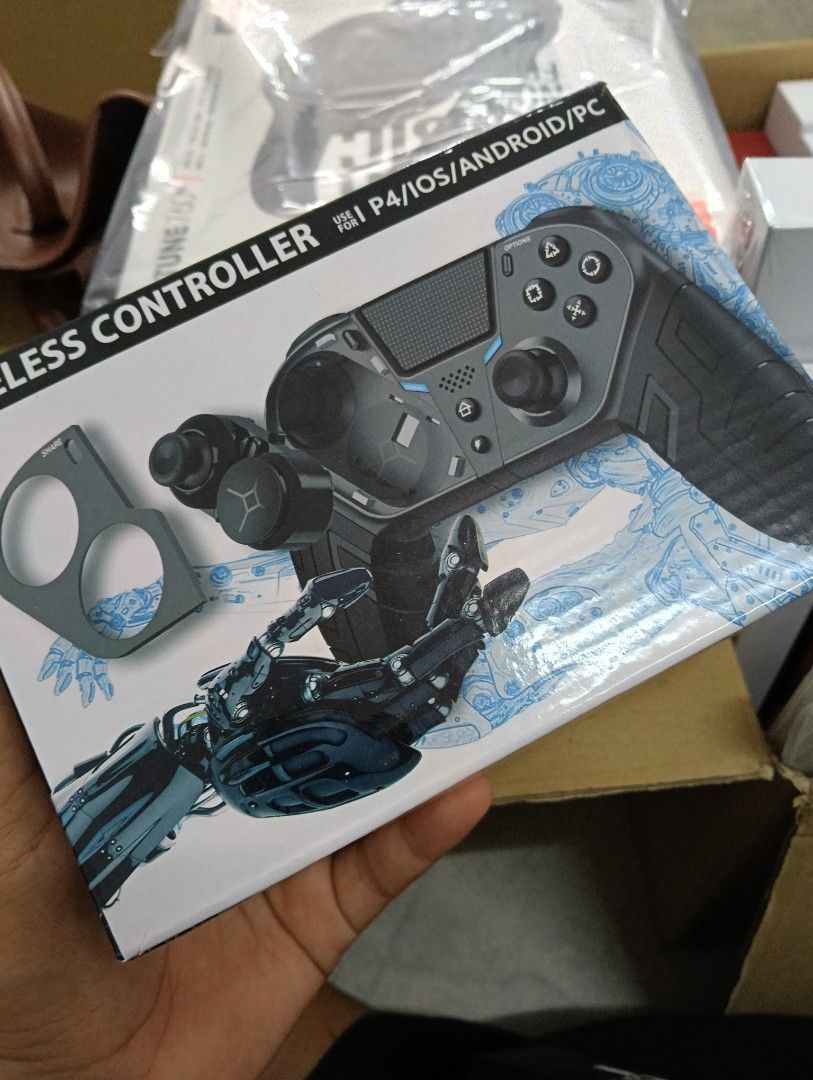 Wireless Controller for P4/iOS/Android/PC (Category: Controllers) located in Kangar. Submitted by nsaurelialegacy (Listing ID 1421994471, Image 1). Description: - Compatible with P4, iOS, Android, and PC. - Includes controller and accessories. - Unique and modern design. - Comfortable grip. - Clear button and joystick visibility. - Designed for a seamless gaming experience..
