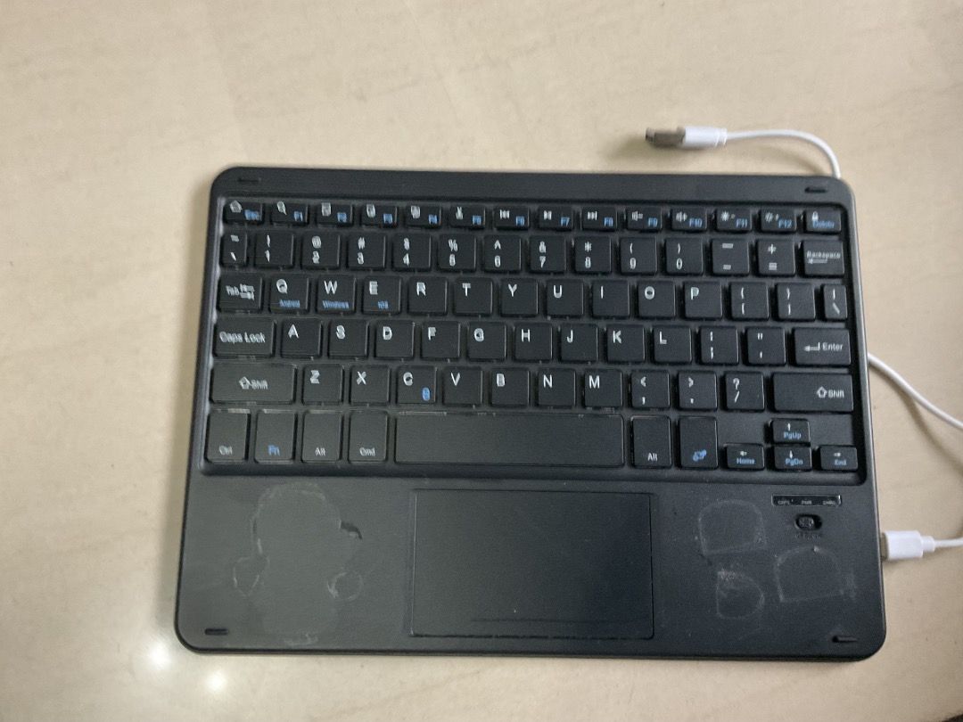 Wireless Keyboard with Touchpad (Category: Computer Keyboard) located in Quezon City. Submitted by gcnt_trift_store (Listing ID 1421954897, Image 2). Description: - Wireless keyboard - Built-in touchpad - Standard keyboard layout with number pad - USB connection - Black color.
