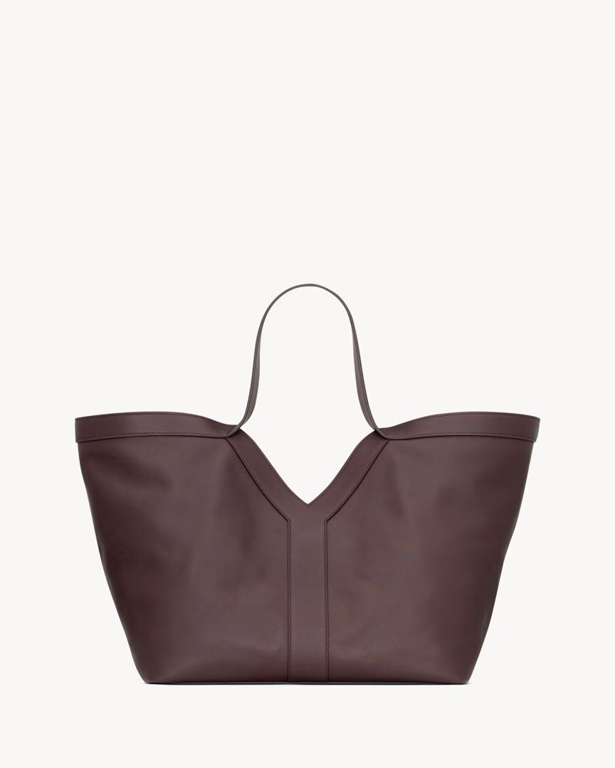 Yves Saint Laurent Maxi Tote Bag (Category: Luxury Bags & Wallets) located in Silang. Submitted by girlyouneedthis (Listing ID 1421998829, Image 1). Description: YSL Y Tote bag in Burgundy, Genuine leather, Fully lined suede interior. Very spacious and light weight with zip pocket and hook closure. Coded, comes with dustbag only. This is a rare color it’s so beautiful in person. DIMENSIONS: Approximately 37 X 32 X 27–22 CM / 14.6 “ X 12.6” X 2.8–