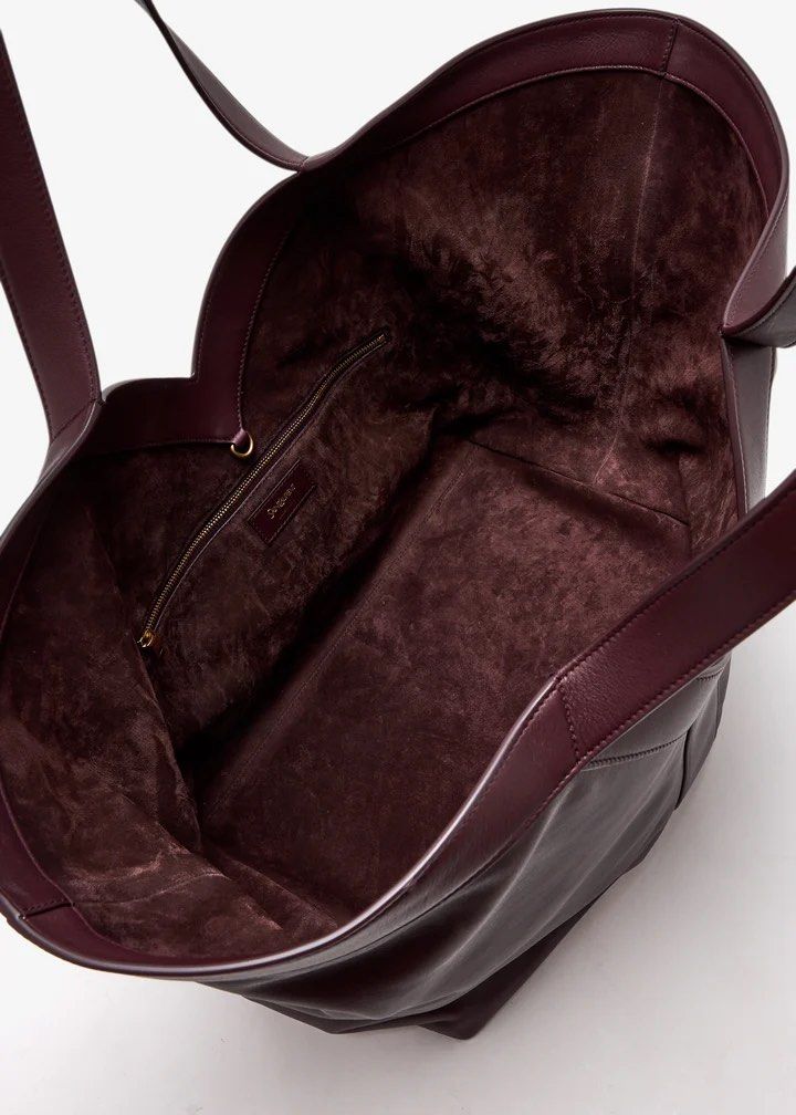 Yves Saint Laurent Maxi Tote Bag (Category: Luxury Bags & Wallets) located in Silang. Submitted by girlyouneedthis (Listing ID 1421998829, Image 3). Description: YSL Y Tote bag in Burgundy, Genuine leather, Fully lined suede interior. Very spacious and light weight with zip pocket and hook closure. Coded, comes with dustbag only. This is a rare color it’s so beautiful in person. DIMENSIONS: Approximately 37 X 32 X 27–22 CM / 14.6 “ X 12.6” X 2.8–