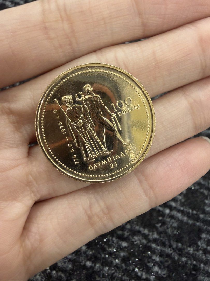 1976 Canada 100 Dollars Coin (Category: Currency) located in Manila. Submitted by aaustriaaa (Listing ID 1422116894, Image 2). Description: - 1976 Canadian Coin - Features Queen Elizabeth II - Olympic design on reverse - Denomination: 100 Dollars - Inscriptions: "CANADA" and "ELIZABETH II".