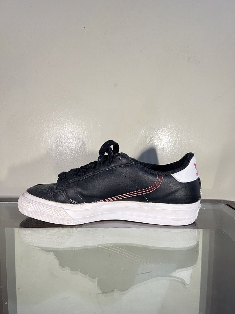 Adidas Continental 80s Black Sneakers (Category: Sneakers) located in Baguio. Submitted by highlandselections (Listing ID 1422118645, Image 2). Description: - Adidas Continental 80s - Black with white soles - Red stitching details - Adidas logo on tongue and heel - US size 5/ UK 4.5 - Made in Vietnam - Black laces - Classic design.