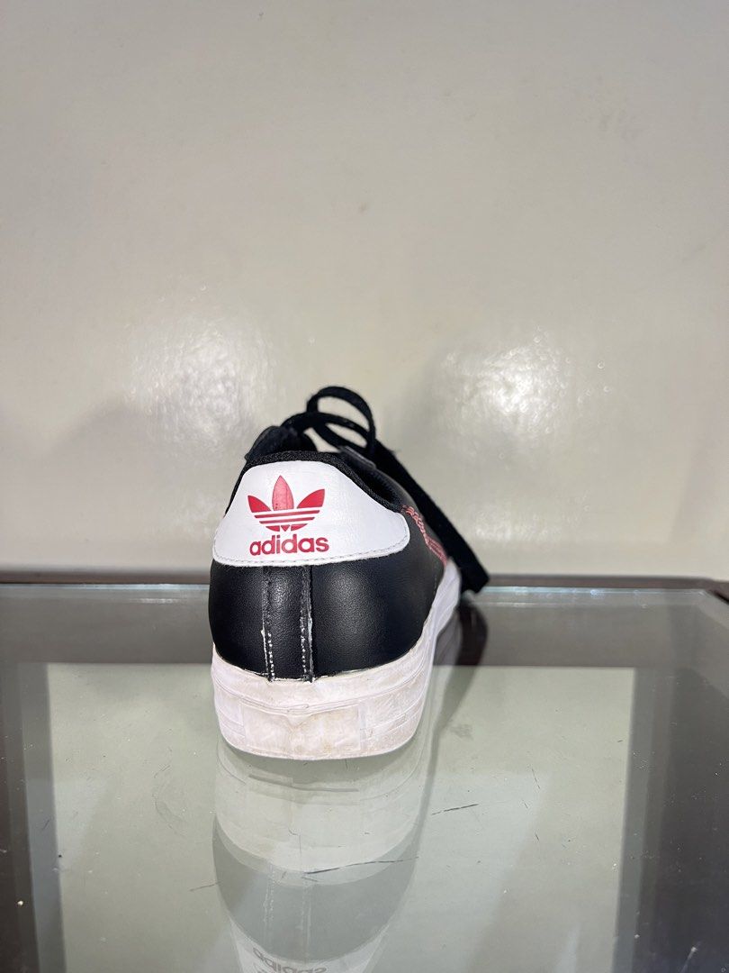 Adidas Continental 80s Black Sneakers (Category: Sneakers) located in Baguio. Submitted by highlandselections (Listing ID 1422118645, Image 3). Description: - Adidas Continental 80s - Black with white soles - Red stitching details - Adidas logo on tongue and heel - US size 5/ UK 4.5 - Made in Vietnam - Black laces - Classic design.