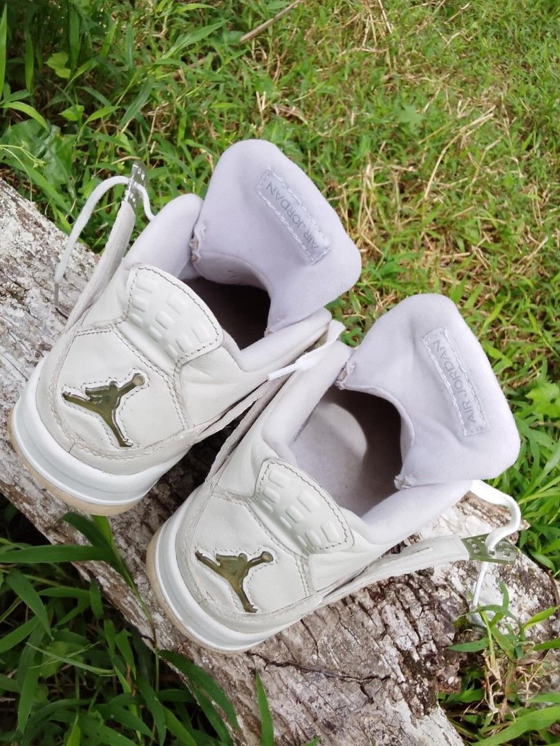 Air Jordan 4 White (Category: Sneakers) located in Calabanga. Submitted by foxsthrift_420 (Listing ID 1422106095, Image 2). Description: - Air Jordan 4 - Color: White - Size: US 8.5Y, UK 7.5,EUR 42 - Features Jumpman logo - Signs of wear on soles and uppers - White laces and inner lining - Mesh detail on the side.