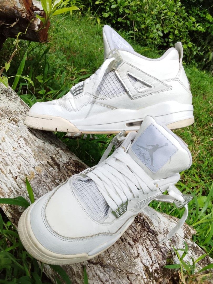 Air Jordan 4 White (Category: Sneakers) located in Calabanga. Submitted by foxsthrift_420 (Listing ID 1422106095, Image 1). Description: - Air Jordan 4 - Color: White - Size: US 8.5Y, UK 7.5,EUR 42 - Features Jumpman logo - Signs of wear on soles and uppers - White laces and inner lining - Mesh detail on the side.