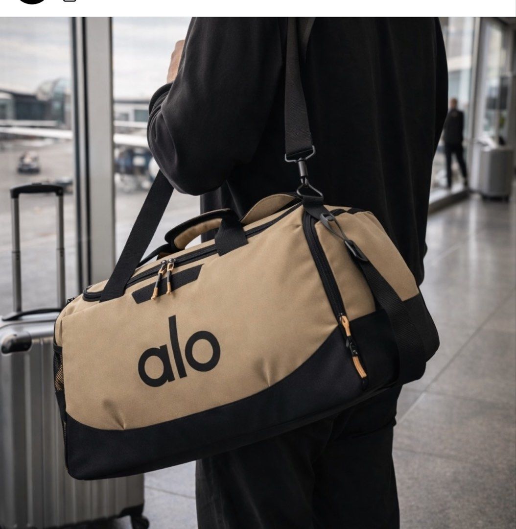 Alo Duffle Bag (Category: Cross-body Bags) located in Manila. Submitted by mabssy-2000 (Listing ID 1422147042, Image 1). Description: - Stylish Alo duffle bag - Ideal for gym or travel - Spacious main compartment - Includes a shoulder strap - Available in multiple colors - Made of durable material - Features the Alo logo.