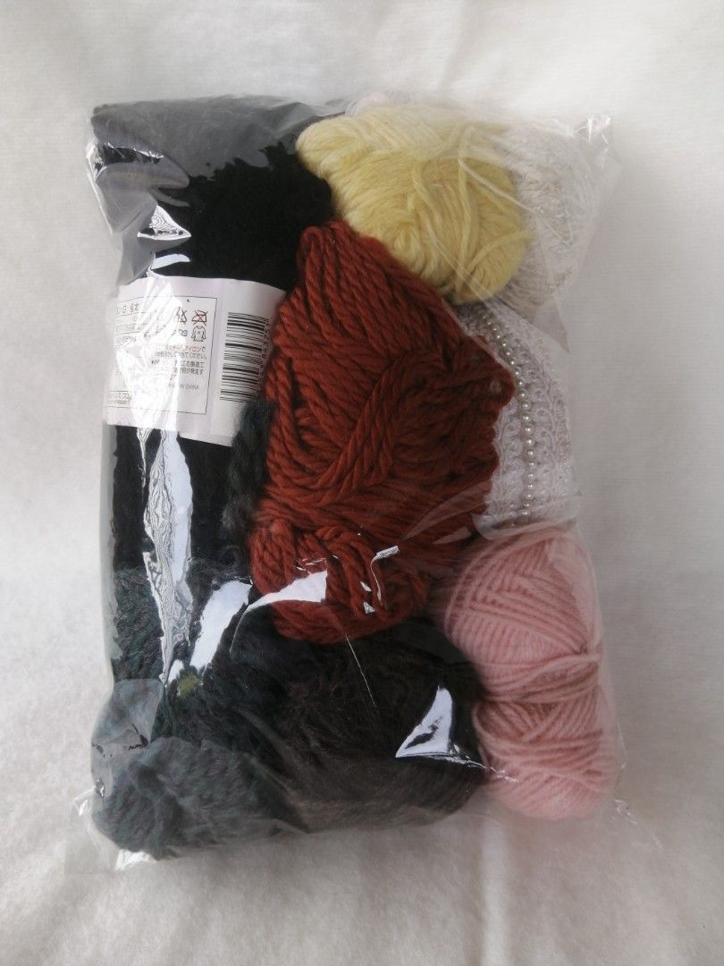 Assorted Yarn Bundle Japan (Category: Craft Supplies & Tools) located in Liloan. Submitted by aidolcapz88 (Listing ID 1422108861, Image 2). Description: - Yarn bundle for crafting. - Colors: Brown, pink, black, and yellow. - Includes a decorative item with a pearl design. - Packaged in a clear plastic bag..