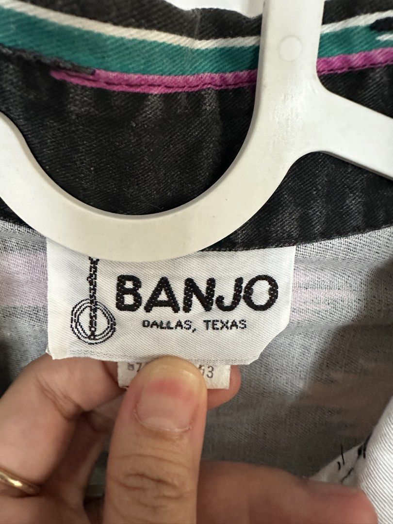Banjo Dallas Texas Vintage jacket (Category: Others Tops) located in Mabalacat. Submitted by jastin17 (Listing ID 1422121014, Image 2). Description: - Vintage Banjo Dallas shirt - Unique southwestern pattern on collar, sleeves, and pocket - Color scheme: White base with black, orange, and teal accents - Features a button-down front - Single pocket - Cropped style.