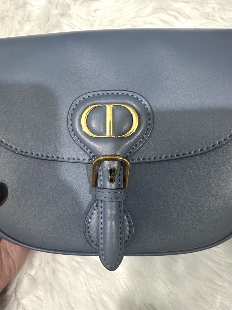 Bobby CD Dior Blue Saddle Bag (Category: Luxury Bags & Wallets) located in Manila. Submitted by amethyste_ph (Listing ID 1422161363, Image 3). Description: Korea source CD 30 Saddle Bag - Color: Blue - Gold-tone CD logo - Buckle closure - Detachable shoulder strap - Spacious interior - Made in Italy.