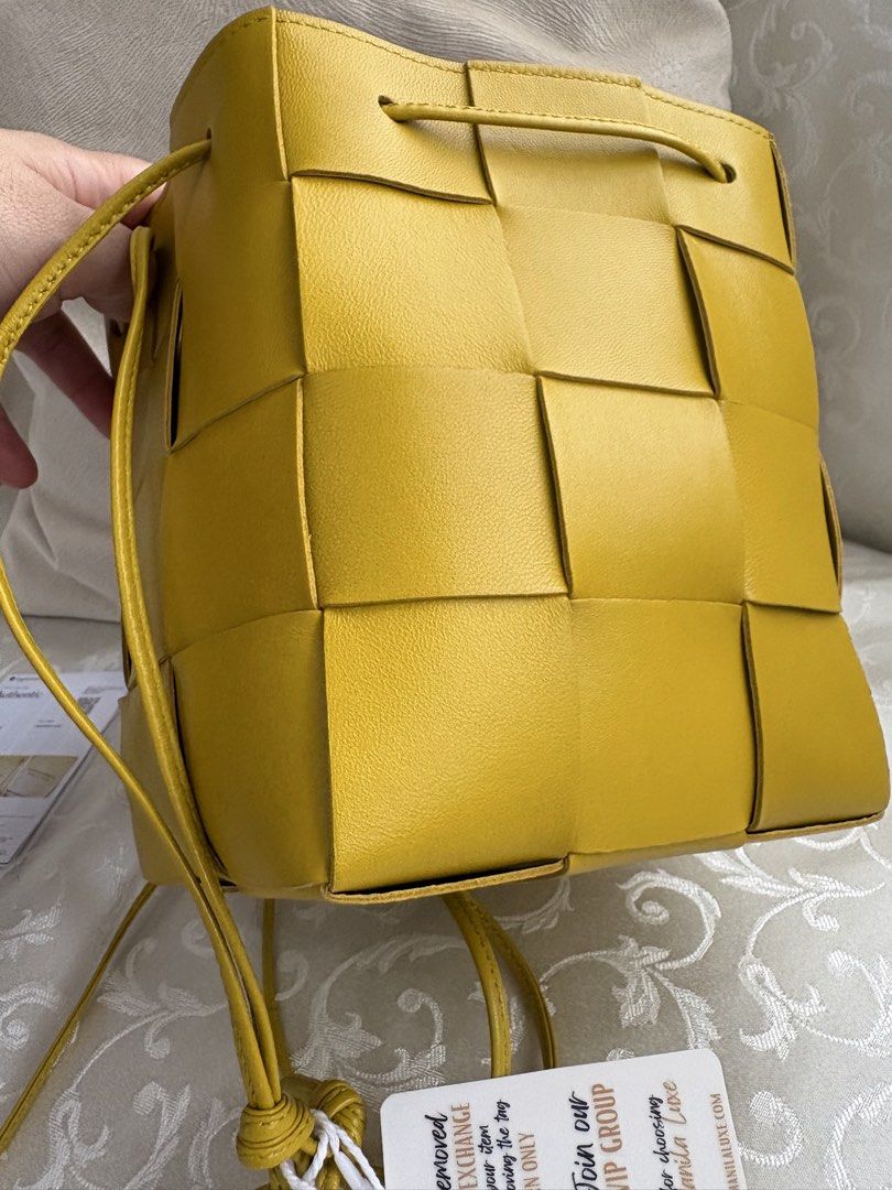 Bottega Veneta Bucket Bag (Category: Luxury Bags & Wallets) located in Bacoor. Submitted by pretticel (Listing ID 1422081769, Image 3). Description: - Authentic Bottega Veneta Mini Jodie Bucket Bag - Vibrant yellow color - Signature Intrecciato weave - Drawstring closure - Single top handle - Includes dust bag and authenticity card - Clean interior - Perfect for everyday use.