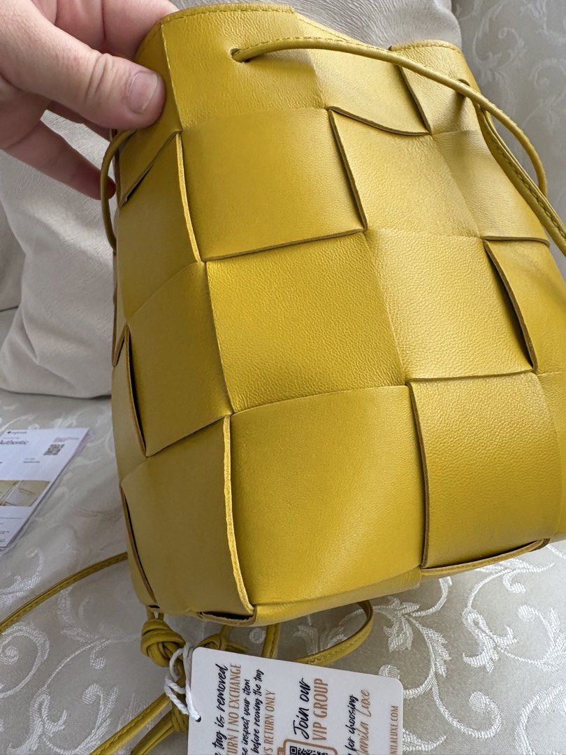Bottega Veneta Bucket Bag (Category: Luxury Bags & Wallets) located in Bacoor. Submitted by pretticel (Listing ID 1422081769, Image 2). Description: - Authentic Bottega Veneta Mini Jodie Bucket Bag - Vibrant yellow color - Signature Intrecciato weave - Drawstring closure - Single top handle - Includes dust bag and authenticity card - Clean interior - Perfect for everyday use.