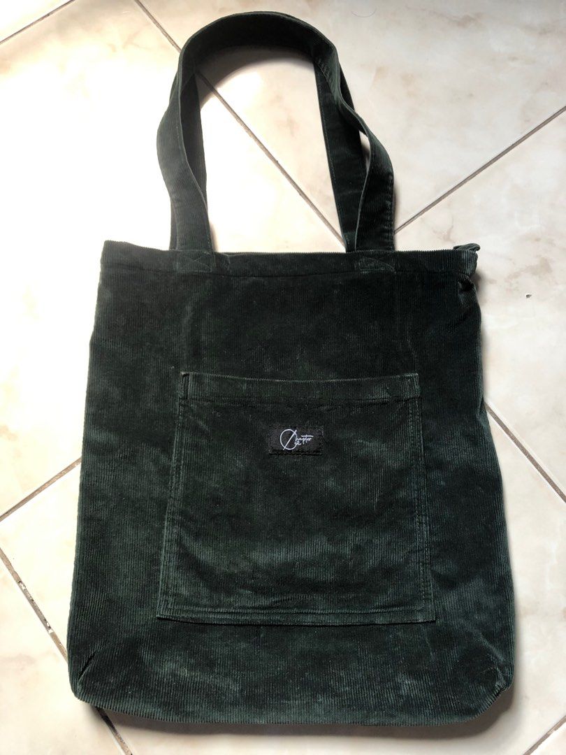 chapter corduroy tote bag (Category: Tote Bags) located in Pasig City. Submitted by teddae (Listing ID 1422154341, Image 1). Description: chapter corduroy tote bag - dark green (color may vary due to lighting) - with zipper, 1 pocket in front and 1 inside the tote - w 14, l 15 rarely used, no flaws 400, pasig loc.