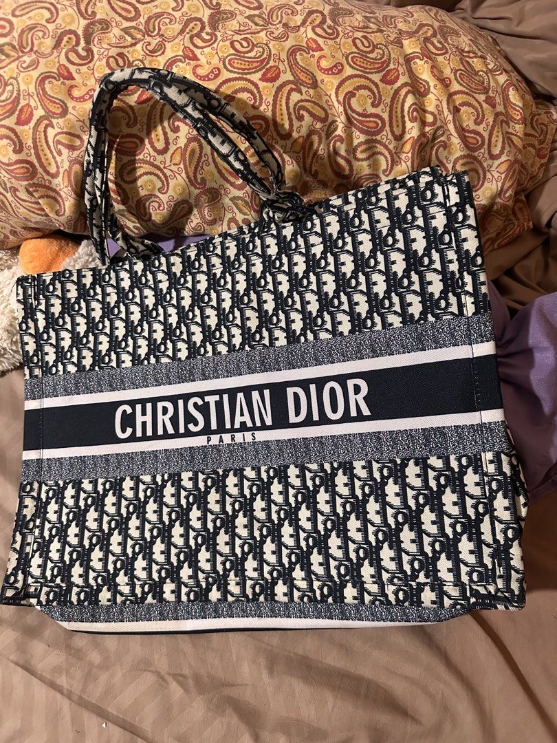 Christian Dior Tote Bag (Category: Tote Bags) located in Quezon City. Submitted by decluttertherapymnl (Listing ID 1422221857, Image 1). Description: Christian Dior tote bag Navy Blue and White RFS Decluttering Payment online or upon pick up Pasig Area.