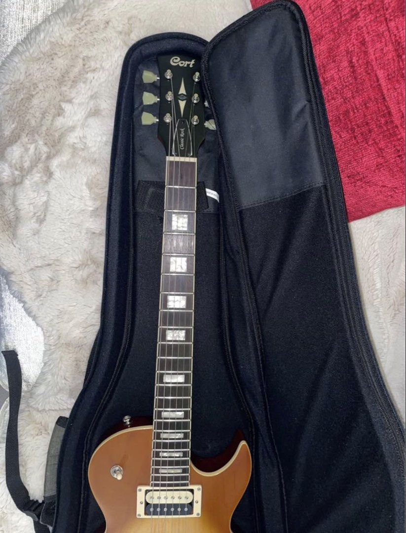 Cort CR300 Classic Rock Electric Guitar (Category: Musical Instruments) located in Manila. Submitted by wavy.scentss (Listing ID 1422200639, Image 2). Description: Very Good Condition Personal Owned I dont really use this Looks Brand new just needs a little cleaning - Cort CR300 electric guitar - Sunburst finish - Includes gig bag and hex key - Set-neck construction - Dual humbucker pickups - Tune-O-Matic bridge - Rosewood fretboard with rectangu