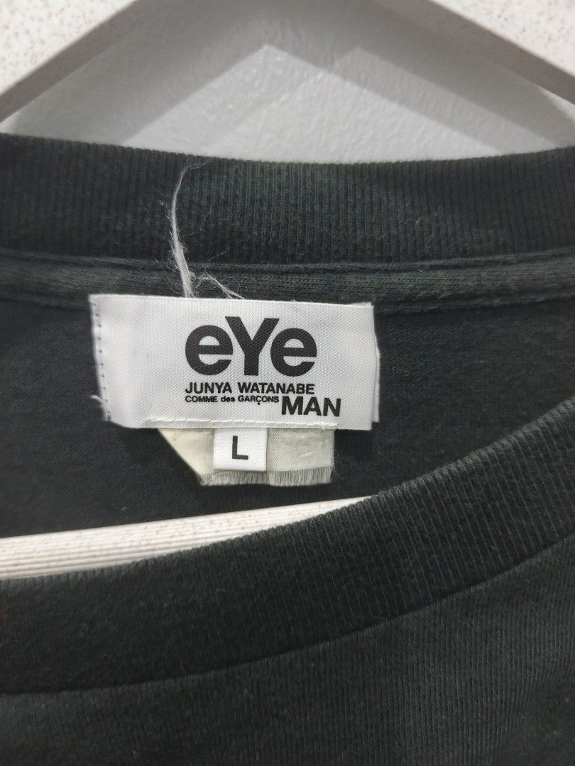 Eye Junya Watanabe Comme des Garcons Man T-shirt (Category: Tshirts & Polo Shirts ) located in Leyte. Submitted by chaem89 (Listing ID 1422185023, Image 3). Description: - Black Eye Junya Watanabe Comme des Garcons Man T-shirt - Size: L - Features brand logo on the back - Small tag detail on the front - Comfortable fabric for everyday wear - Classic crew neck design - Short sleeves - No Issue.