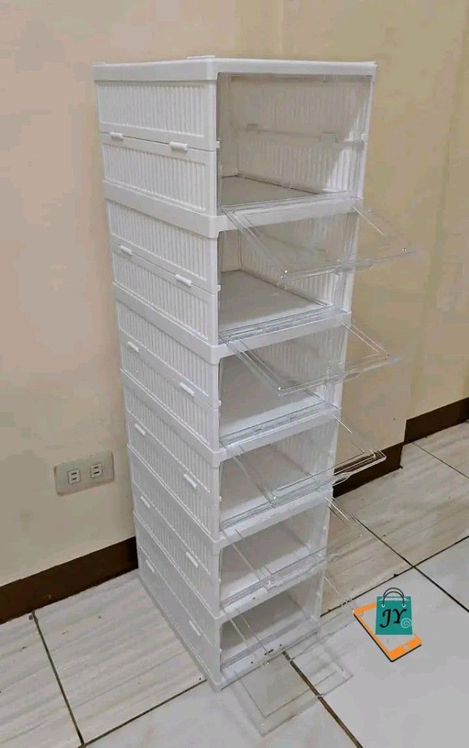 Foldable Shoe Storage Box (Category: Storage Boxes & Baskets) located in Manila. Submitted by ashleyeshk1320 (Listing ID 1422104246, Image 2). Description: - Foldable shoe storage box - Clear door for easy viewing and access - Stackable design - Easy to assemble and disassemble - Dimensions: 25.5cm x 34.5cm x 19.5cm - Space-saving solution.