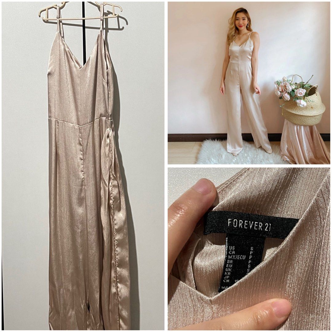 Forever 21 Satin Jumpsuit (Category: Jumpsuits) located in Pasay City. Submitted by declutternstuff_yo (Listing ID 1422107161, Image 1). Description: - Forever 21 jumpsuit comes with belt - Champagne color - Size can fit xs - s - Used once for an event, bought it for 2k+ - perfect for events/dinner dates.