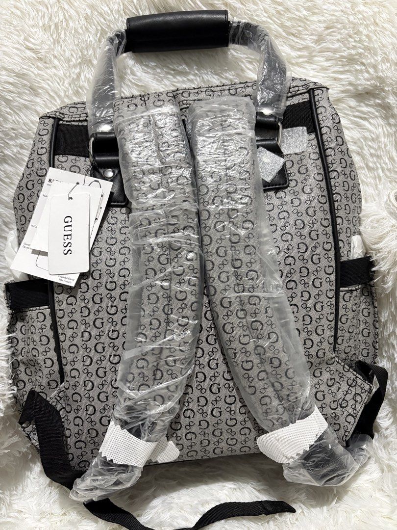 Guess Diaper Bag Backpack (Category: Backpacks) located in Manila. Submitted by hjuaneza22 (Listing ID 1422197844, Image 2). Description: - Guess backpack with all-over G logo - Top handle and adjustable shoulder straps - Front pocket with Guess logo - Lined interior with Guess logo fabric - Includes detachable shoulder strap - Ideal for everyday use and travel.