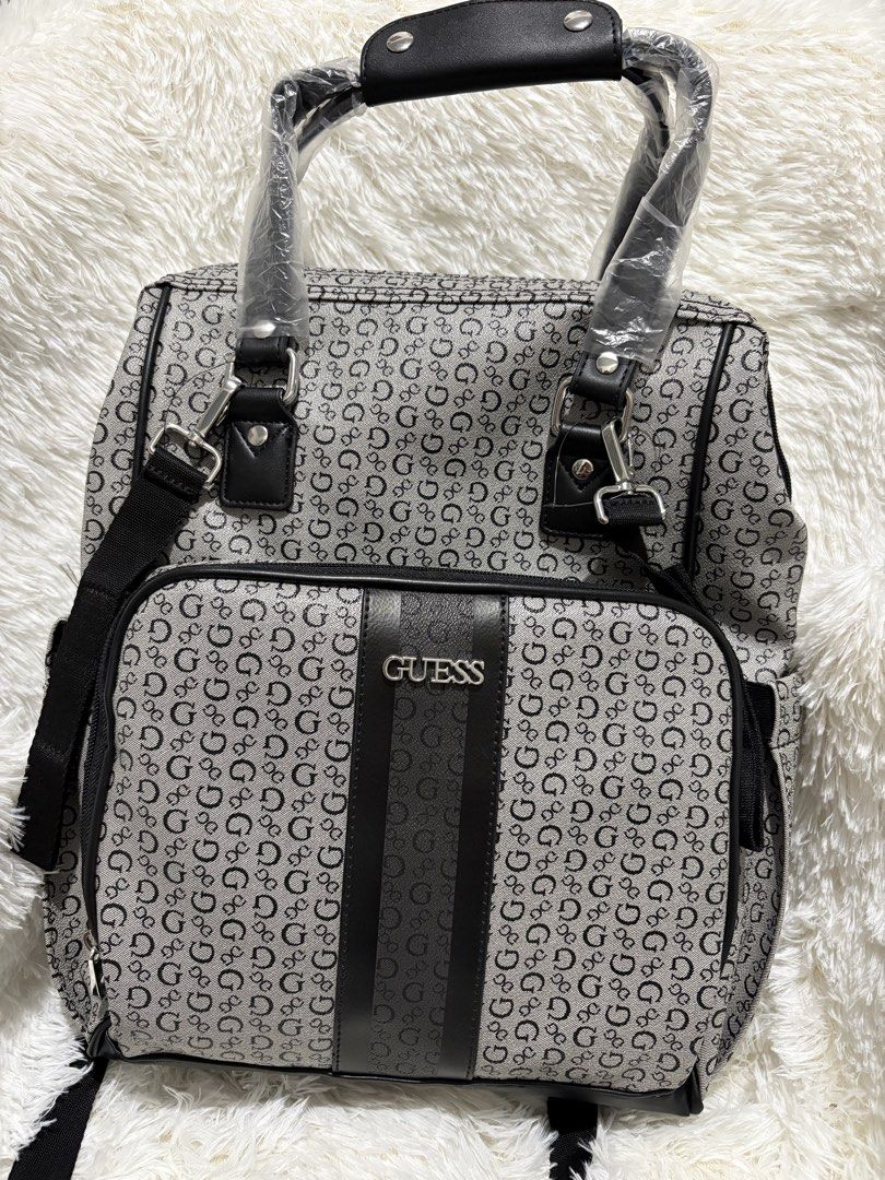 Guess Diaper Bag Backpack (Category: Backpacks) located in Manila. Submitted by hjuaneza22 (Listing ID 1422197844, Image 1). Description: - Guess backpack with all-over G logo - Top handle and adjustable shoulder straps - Front pocket with Guess logo - Lined interior with Guess logo fabric - Includes detachable shoulder strap - Ideal for everyday use and travel.