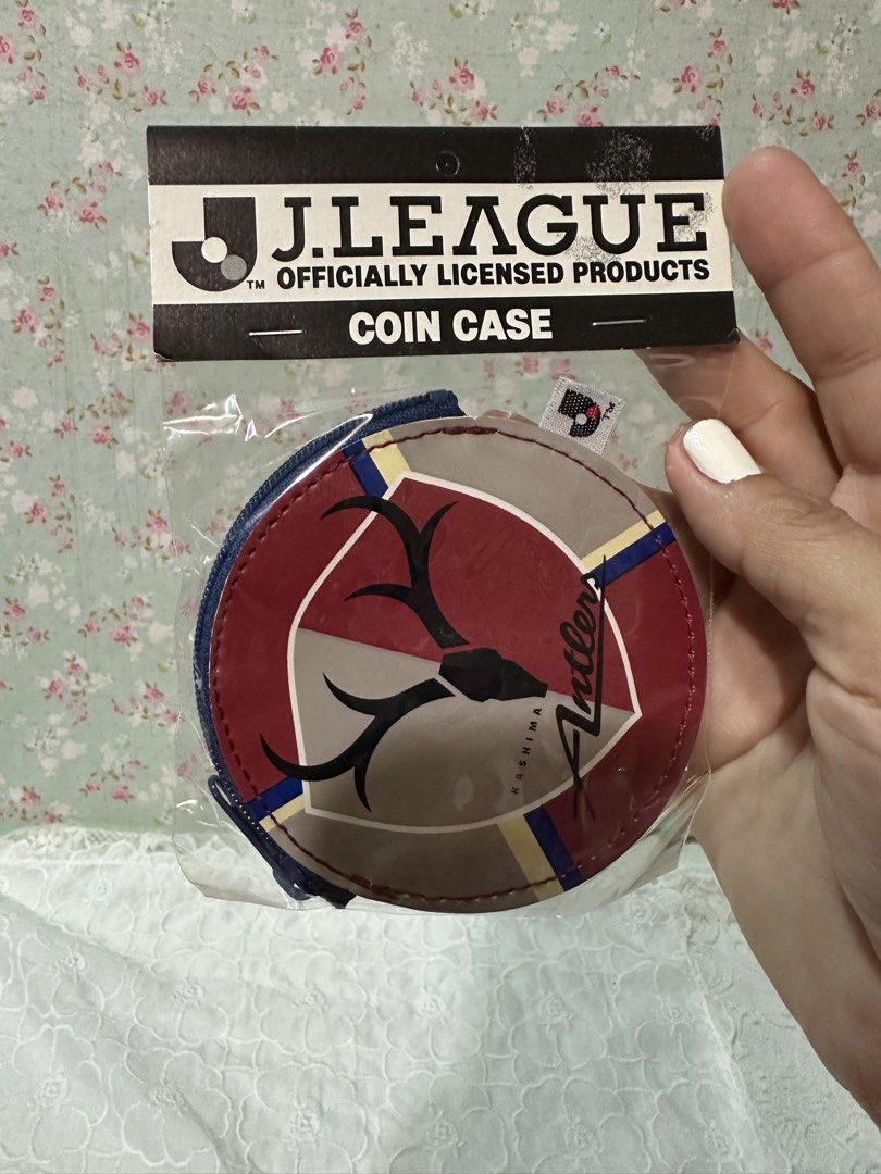 j.league Officially Licensed Coin Purse (Category: Wallets & Card holders) located in Davao. Submitted by favoritepreloved (Listing ID 1422190812, Image 1). Description: - Officially licensed J.League product - Features the Antlers logo - Includes the Japan Professional Football League logo - Round coin case with zipper closure - Brand new, still in original packaging - Made in Japan.