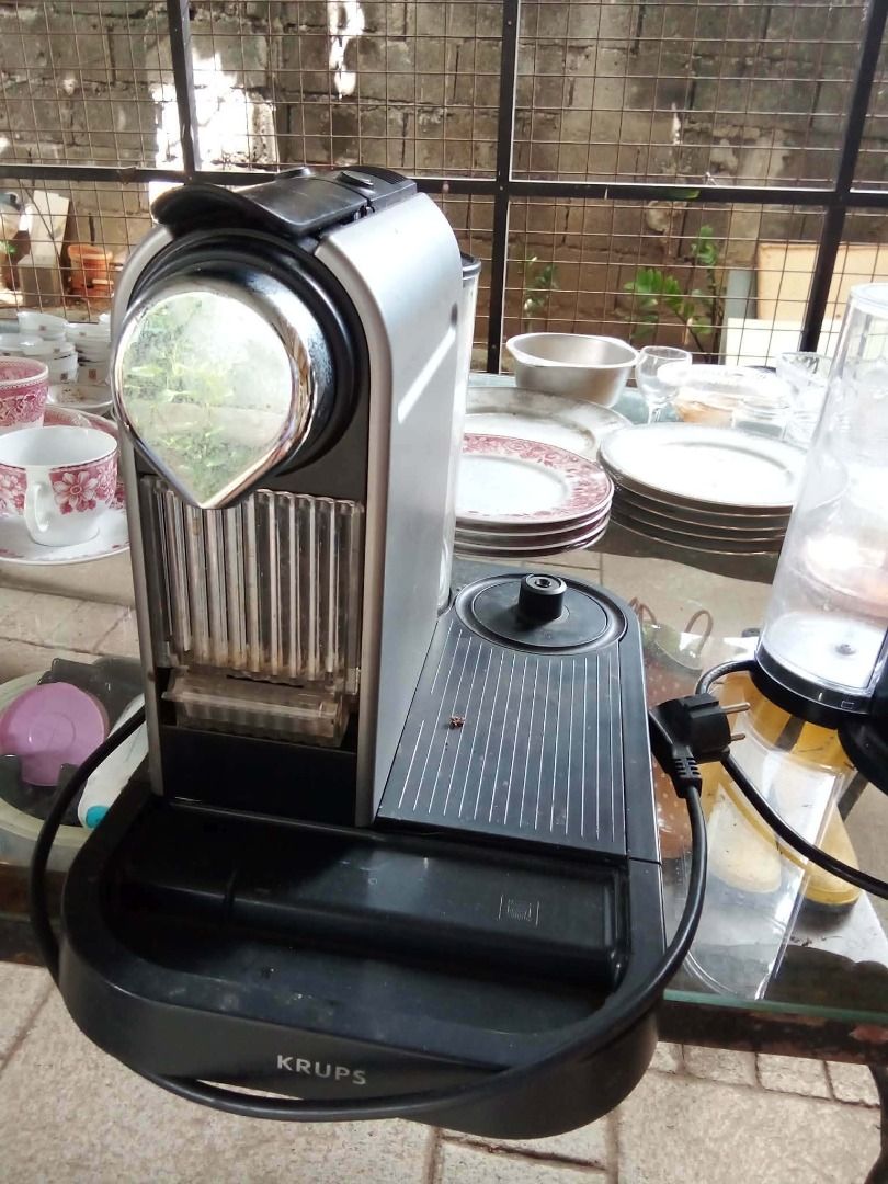 Krups Coffee Machine (Category: Coffee Machines & Makers) located in Calamba. Submitted by jomariacri08453 (Listing ID 1422148372, Image 2). Description: Features a silver and black design with a water reservoir. Includes a drip tray and a power cord. Perfect for making your favorite coffee at home. - MISSING STAINLESS DRIP TRAY - MISPLACED MILK FROTHER NA DAPAT NAKALAGAY SA SIDE KAYA I'M SELLING THIS LOW BUT STILL WORKING - FROM GERMANY - NEEDS 