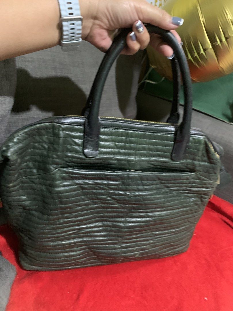 Lanvin Green Leather Handbag (Category: Luxury Bags & Wallets) located in Liloan. Submitted by jinalyns (Listing ID 1422229536, Image 2). Description: - Authentic Lanvin handbag - Green leather - Top zip closure - Gold-tone hardware - Front zip pocket - Fabric lining - Interior pocket - Two top handles - Protective feet - Lanvin logo inside.