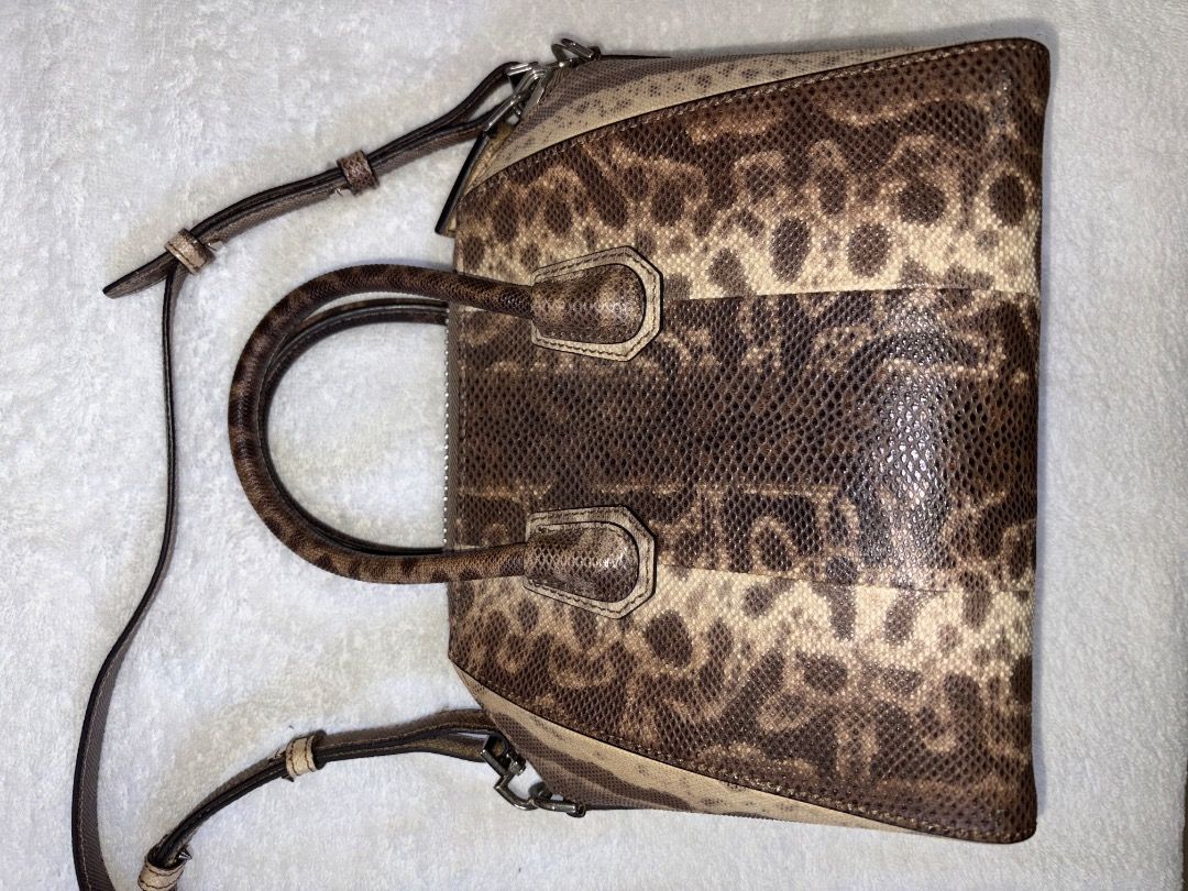 Lizard Skin Handbag with Top Handle (Category: Luxury Bags & Wallets) located in Tagaytay City. Submitted by kyle870 (Listing ID 1422152516, Image 3). Description: - Lizard Skin - Top handle and detachable shoulder strap - Brown and beige color scheme - Main compartment and smaller pocket - Structured shape - Genuine leather construction can do meetup around Cavite/Manila.