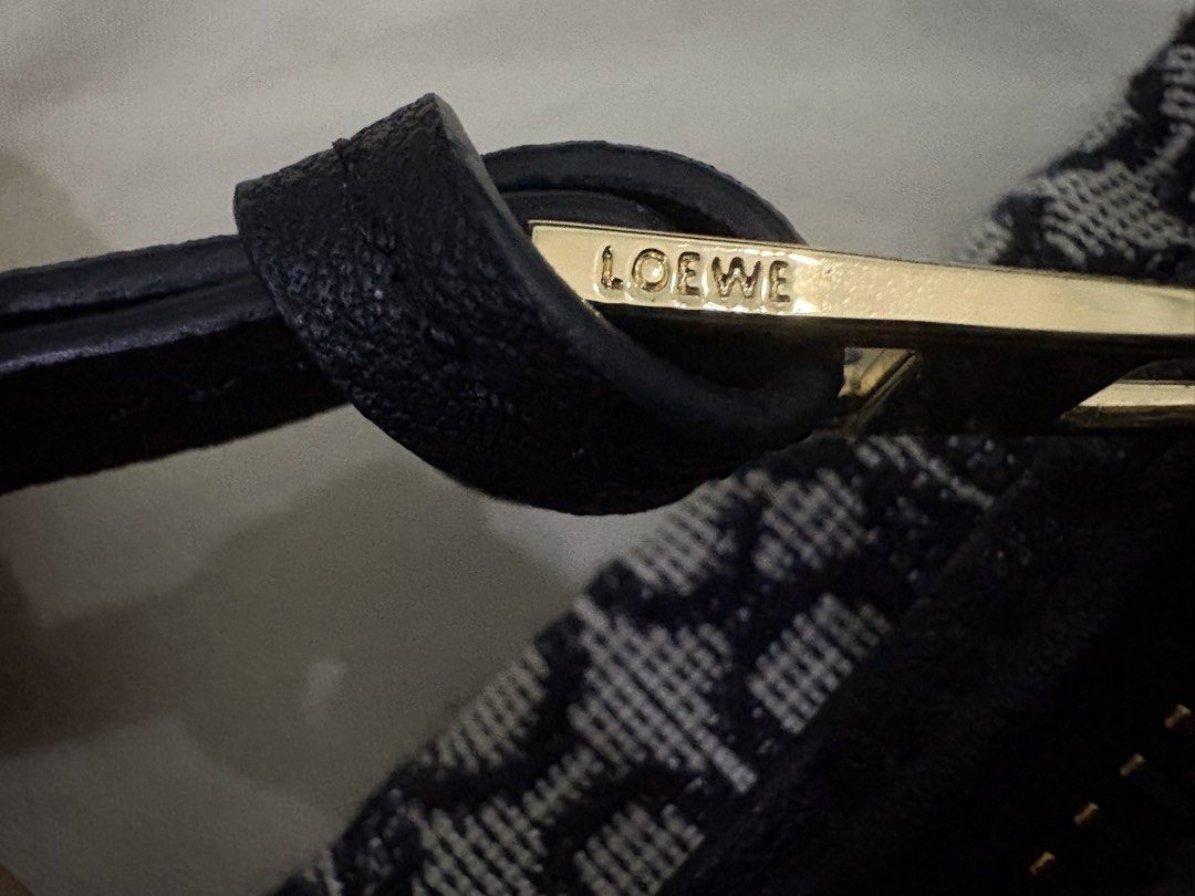 Loewe Cubi Anagram Handbag (Category: Luxury Bags & Wallets) located in Manila. Submitted by journeypreloved (Listing ID 1422167472, Image 3). Description: - Black leather strap - Gold-toned zipper - Made in Spain - Light-colored fabric lining -Like-new Issue: - may cabinet smell Authenticity not guaranteed since sa seller ko lang din nabili before..