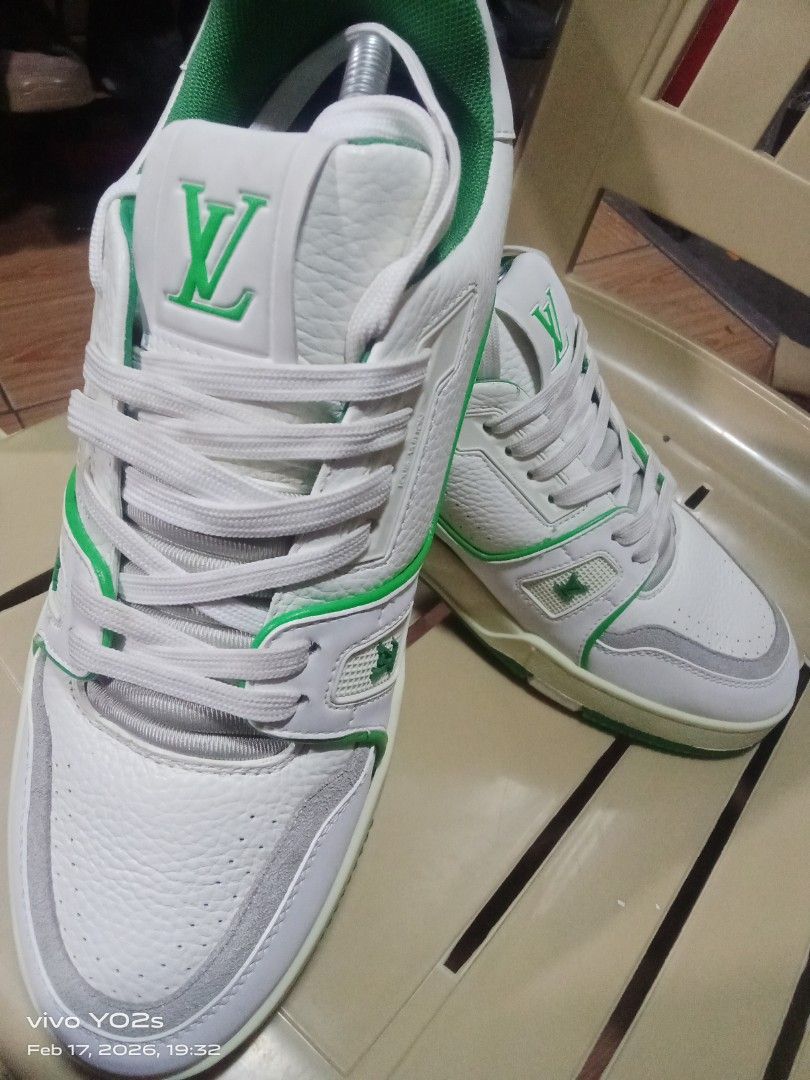Louis Vuitton LV Trainer Sneaker White Green (Category: Sneakers) located in Koronadal. Submitted by glads08089 (Listing ID 1422111487, Image 1). Description: - Authentic Louis Vuitton LV Trainer sneakers - White and green color scheme - Features LV logo on side and tongue - Green soles with "VUITTON" branding - Size: 54 - Includes shoe trees.