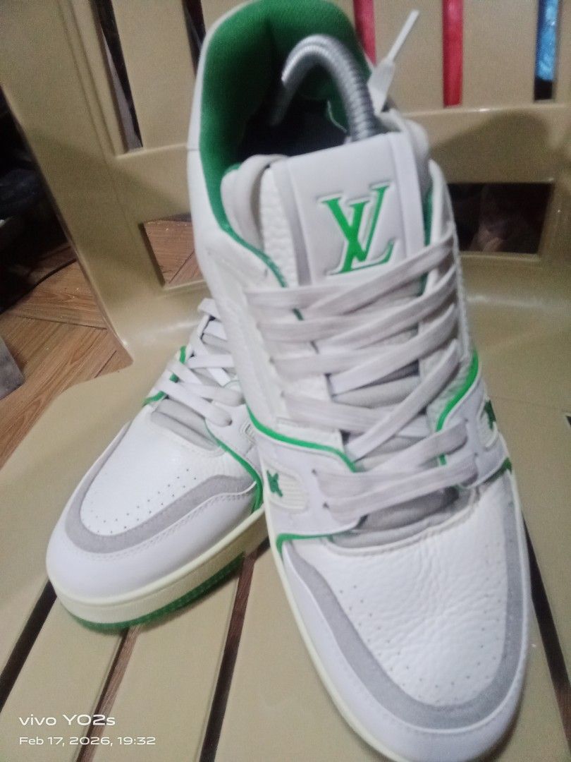 Louis Vuitton LV Trainer Sneaker White Green (Category: Sneakers) located in Koronadal. Submitted by glads08089 (Listing ID 1422111487, Image 2). Description: - Authentic Louis Vuitton LV Trainer sneakers - White and green color scheme - Features LV logo on side and tongue - Green soles with "VUITTON" branding - Size: 54 - Includes shoe trees.