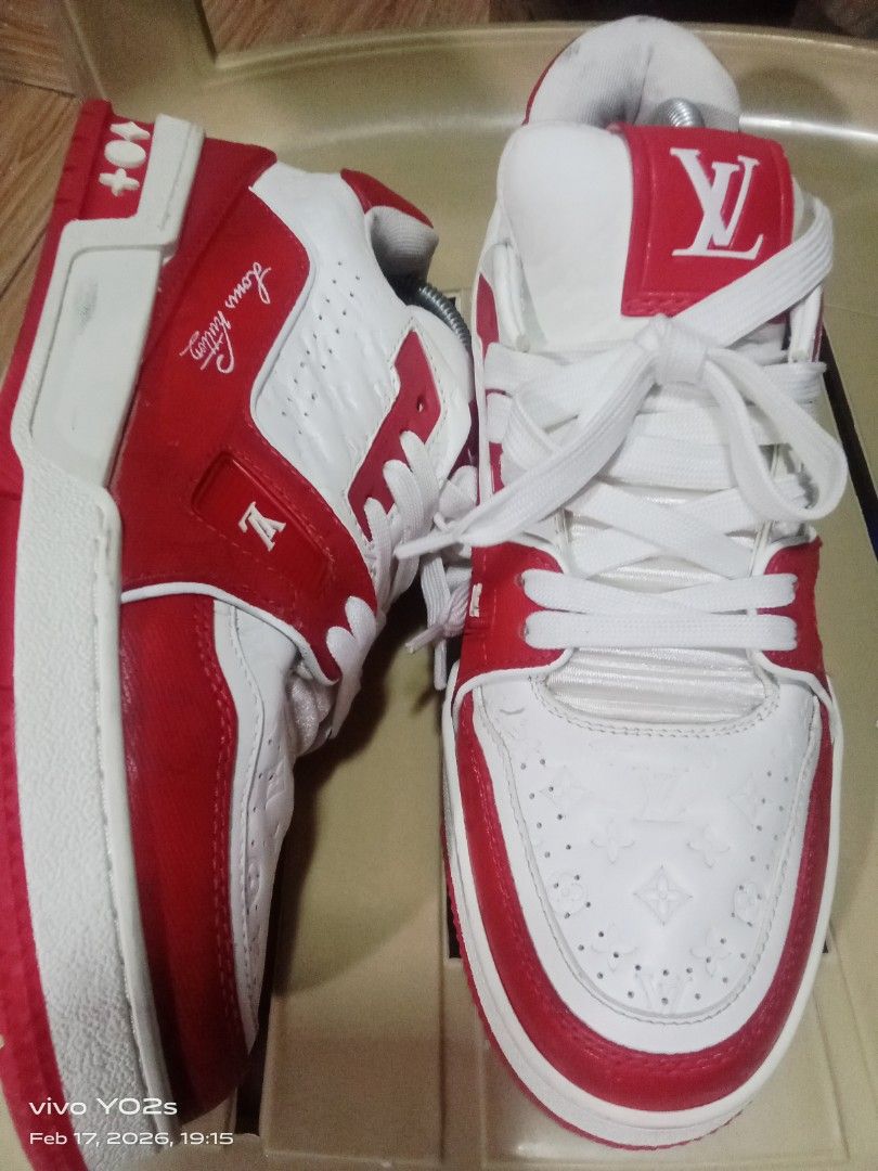Louis Vuitton LV Trainer Sneakers Red White (Category: Sneakers) located in Koronadal. Submitted by glads08089 (Listing ID 1422112242, Image 2). Description: - Authentic Louis Vuitton LV Trainer sneakers - Color: Red and White - Features the iconic LV logo - Design: White base with red accents and red sole - Back detail: Number "54" - Sole marking: "Vuitton".