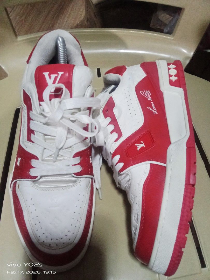 Louis Vuitton LV Trainer Sneakers Red White (Category: Sneakers) located in Koronadal. Submitted by glads08089 (Listing ID 1422112242, Image 3). Description: - Authentic Louis Vuitton LV Trainer sneakers - Color: Red and White - Features the iconic LV logo - Design: White base with red accents and red sole - Back detail: Number "54" - Sole marking: "Vuitton".