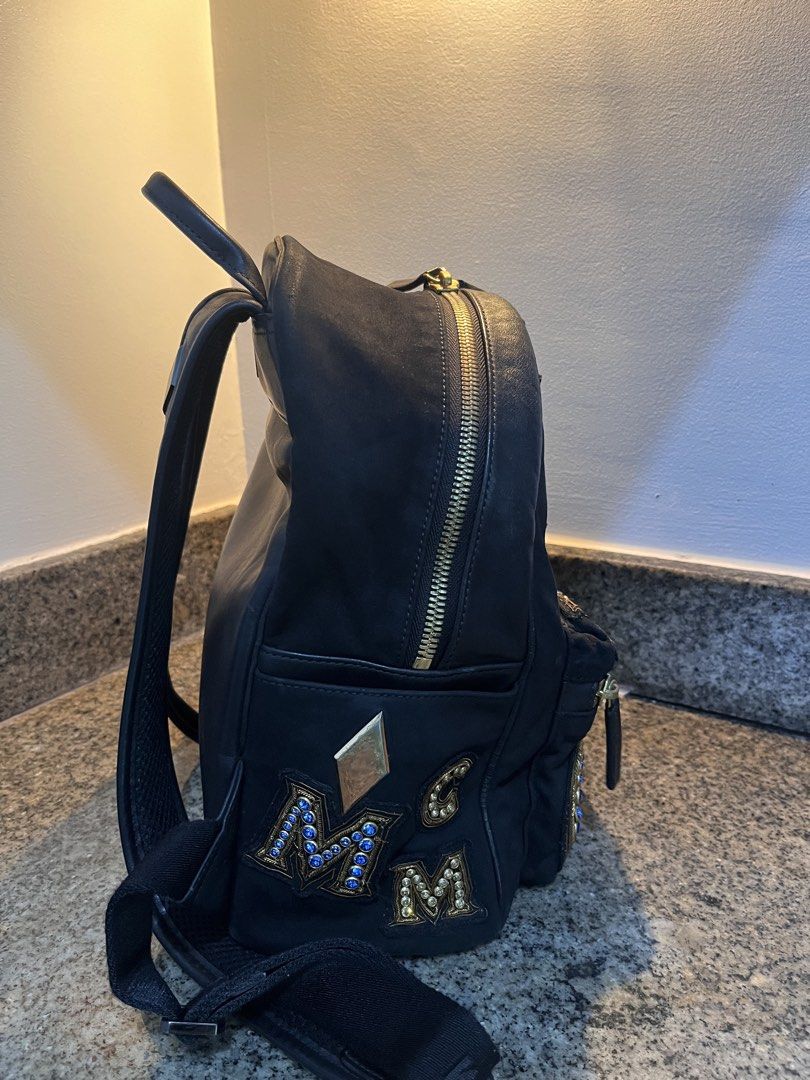 MCM Stark Crown Jewel Small Backpack Black (Category: Luxury Bags & Wallets) located in Makati City. Submitted by railey_declutter (Listing ID 1422135749, Image 3). Description: - Minimal Sratches - PRE OWNED -NEGOTIABLE -FB: Railey Andre Capati.