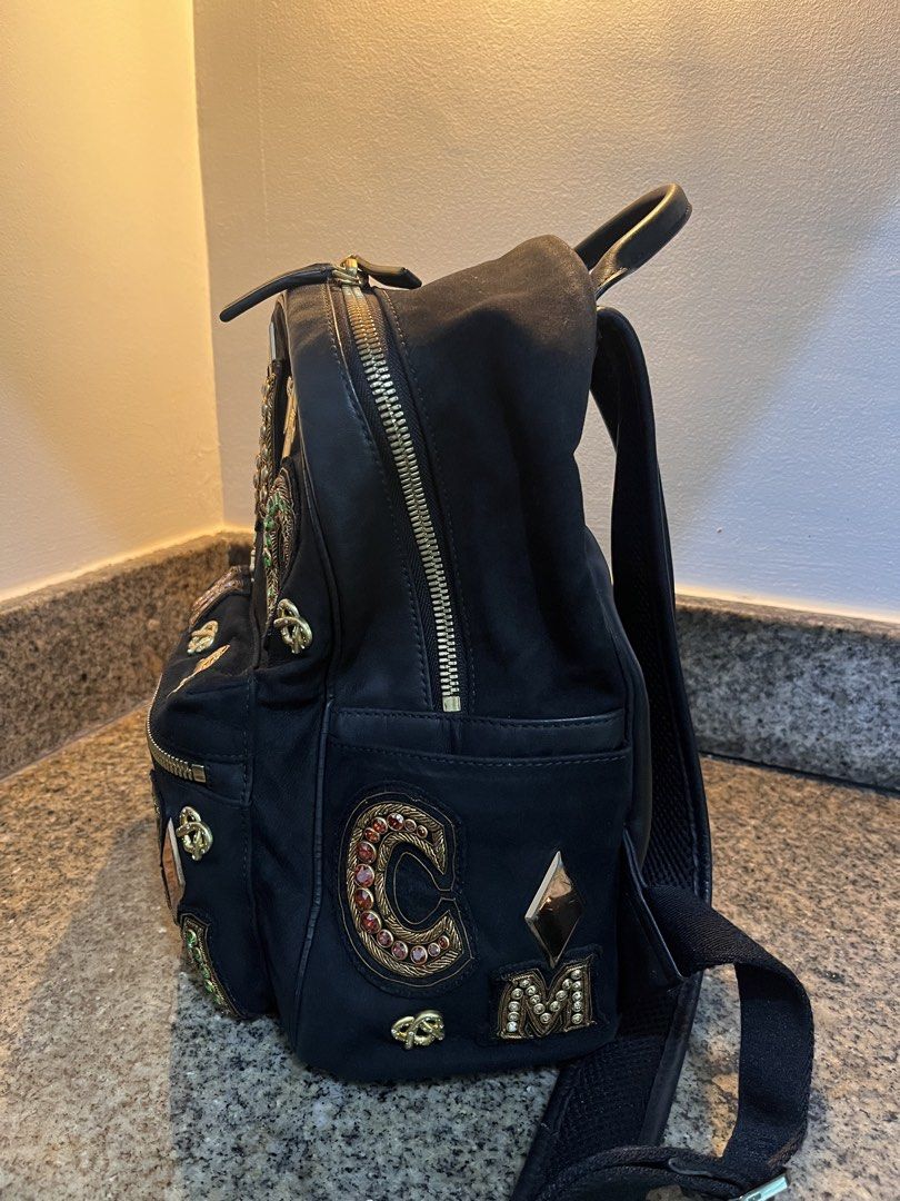 MCM Stark Crown Jewel Small Backpack Black (Category: Luxury Bags & Wallets) located in Makati City. Submitted by railey_declutter (Listing ID 1422135749, Image 2). Description: - Minimal Sratches - PRE OWNED -NEGOTIABLE -FB: Railey Andre Capati.