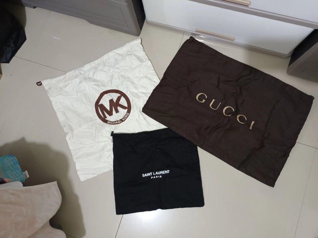 Michael Kors Dust Bag (Category: Luxury Bags & Wallets) located in Irosin. Submitted by whanchore55263 (Listing ID 1422099943, Image 2). Description: - Authentic Michael Kors dust bag - White satin drawstring bag - Features the MK logo - Ideal for bag protection - Ready to use - Also available: Gucci and Saint Laurent dust bags.