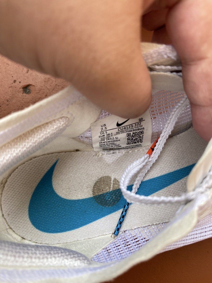 Nike Vaporfly Running Shoes (Category: Sneakers) located in Bacolod City. Submitted by 0411a (Listing ID 1422120962, Image 3). Description: Nike Vaporfly running shoes. Features a white and blue colorway with orange accents. The shoes have a ZoomX midsole and a Vaporfly logo on the tongue. The size is US 7.5, EUR 38.5, and CM 24.5 The shoes have some wear on the soles and insoles. AUTHENTIC!!! (no box).
