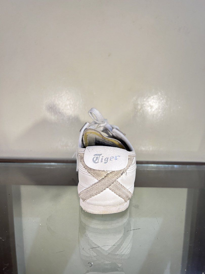 Onitsuka Tiger DL408 White Sneakers (Category: Sneakers) located in Baguio. Submitted by highlandselections (Listing ID 1422116717, Image 3). Description: - Onitsuka Tiger DL408 sneakers - US Size: 4, EUR: 36, 22.5 cm - Iconic tiger stripes design - Made in Indonesia - Material: Leather upper, Rubber sole - Features the Tiger logo at the back.
